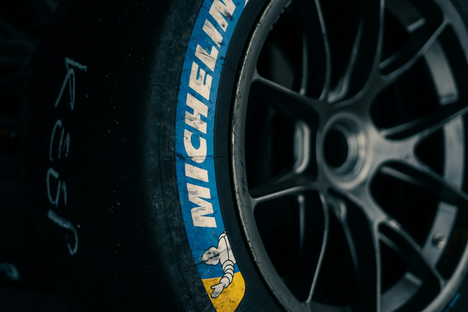 Close up of a racing tire with michelin branding.